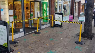 Health and safety queue barriers in use by specsavers